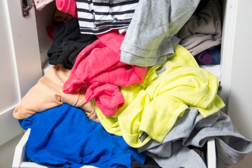 Workers loading garden waste into a van in Sidcup neighbourhood